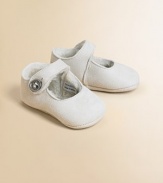 Darling, lamb shearling Mary Janes will keep her stylish little feet warm and cozy.Button closureLamb shearling upperRubber soleDry cleanImported