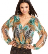 Work the party circuit in a top that has pop power! This blouson style from Baby Phat features an exotic print and sexy open-back design.