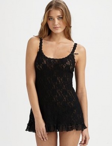A sultry look of semi-sheer mesh lace featuring a ruffled hem and scalloped edges, topped off with a sweet bow. ScoopneckThin straps with scalloped edgesG-string with cotton gussetNylonHand washMade in USA