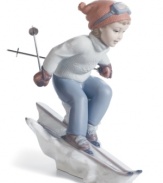 It's time to race in this beautifully crafted porcelain figurine as a little girl hits the slopes with skis and full winter outfit. Handcrafted from Lladro.