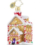 A sweet treat. Crafted of luxe gold sparkles, minty candy canes and fruity gum drops, this ornament from Christopher Radko exudes holiday cheer upon your tree. Sugary sparkles drape the house in frosty snow.