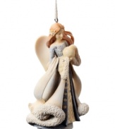 A guardian angel to watch over your and your family, this Angel with Globe ornament sits upon your tree throughout the season, boasting a gentle look with crystal embellishments.