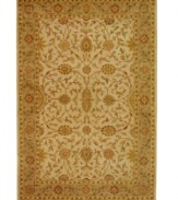 A beautifully balanced vine-and-blossom motif is captured in hushed ivory tones on this awe-inspiring area rug from Safavieh. Tufted in India from pure wool, this rug emerges from the annals of antiquity to bring spectacular style and time-honored quality to your home. (Clearance)