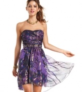 Breeze into the party in a dress designed to steal the spotlight. From the gorgeous metallic-treated print to the slight high-low hem, this frock is a chic yet timeless choice.