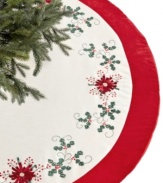 Festive from the ground up. Ribbon poinsettia blossoms stitched in Jabara's red and white tree skirt complement your Christmas tree with crafted elegance.