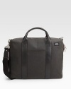 A classically designed case in a fine cotton canvas soaked in a centuries-old paraffin formula for greater strength and abrasion resistance. Zip closure Top handle Adjustable, detachable shoulder strap Interior organizing pockets 16W X 11¾H X 2¾D Imported 