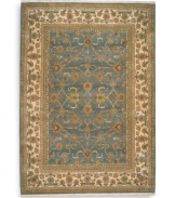 Inspired by an early 20th century Sultanabad design, this rug features a graceful floral motif against a soft blue background that recalls the tranquil night sky. Individual skein-dyeing enhances the rich tones of a palette that includes rose quartz, peridot, amber, citrine, amethyst and topaz. A patented luster wash creates a vintage finish faithful to the craftsmanship of the original. Woven in the USA of premium fully worsted New Zealand wool.