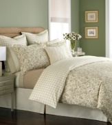 Simply soothing. In a restful palette of tan and cream, this Wildwood Flannel duvet cover outfits the room in classic nature-inspired style, featuring a lovely winding floral design. Reverses to a plaid pattern.