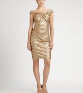 Sparkling metallic sequins and a twisted neckline define this party-perfect style.Twist-front necklineCap sleevesAllover sequinsConcealed back zipFully linedAbout 21 from natural waistPolyesterDry cleanMade in USA of imported fabricModel shown is 5'10 (177cm) wearing US size 4. 