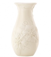 Teeming with fresh blooms, the Floral Fields vase from Lenox exudes a serene, understated elegance. A simple silhouette in creamy ivory porcelain balances elaborate sculpted detail. Qualifies for Rebate