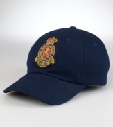 A classic baseball cap in durable washed cotton twill features a signature embroidered crown-and-crest patch for authentic naval styling.