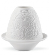Set your table aglow with a beautiful white porcelain candle holder, featuring a fresh snowflake design. Handcrafted by Lladro.