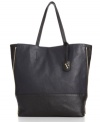 Crafted from glazed sheep leather with a glossy finish, this tall tote is notable for elegant lines that can be altered with a quick pull of the vertical zips.