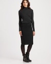 Rich wool knit hugs the body in a sleek pencil silhouette.High banded waistSide panelsCenter back zipperVented hemAbout 22 longWoolDry cleanImported