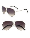 Sleek metal frames with a double bridge detail. Available in gold with gray gradient lens. 100% UV protection Made in Italy 