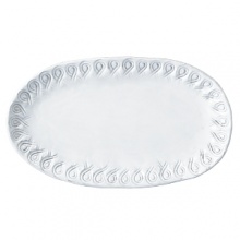 Handmade and inspired by the maestro artisan's family heirloom dinnerware, this white platter makes an elegant display for appetizers.