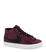 Looks meet performance in these retro-chic Nike sneakers, with a mid-rise silhouette and chic leather uppers.