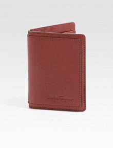 Bifold design crafted of rich Italian leather with topstitching and logo detail. Two card slots Two inside compartments ID window 3W X 4H Made in Italy 