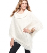 American Rag's poncho is trend-forward with statement-making fringe! Cuddle up in fashionable warmth.