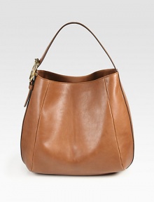 Washed leather design finished with an adjustable buckle strap and antique hardware. Adjustable top handle, 6¼-7¾ dropOne inside zip pocketTwo inside open pocketsNatural cotton linen lining16W X 12¾H X 7DMade in Italy
