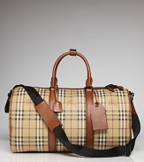 Ready for a weekend in the city or an escape to the country lodge, the Vintage Haymarket leather weekender features Burberry's signature plaid, tote handles and an adjustable shoulder strap.