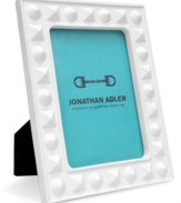 Jonathan Adler ensures modern spaces shape up nicely with this Charade picture frame, crafted of matte white porcelain studded with detail.