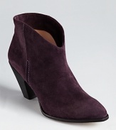 A western-inspired bootie silhouette from Belle by Sigerson Morrison slips on with a flowing skirt for bohemian chic.