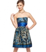 Trixxi delivers whimsy to a classic A-line dress by way of a dynamic print! Spice it up even more with stately accessories for a party look that has impact!