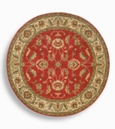 A larger-diameter round that is ideal for oversized rooms, this classic Agra rug features a scrolling vine design of oversized palmettes and serrated leaves. The green and ivory tones in the palmette border perfectly complement the dynamic color shadings of the rich red ground. Special color treatment creates a gentle finish. Woven of premium worsted New Zealand wool for indulgent softness.