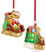 Two fun-loving bears get in the spirit, taking a ride on Santa's sleigh. Stacked with gifts and sparkling with glitter, this Holiday Lane ornament makes every Christmas merry. Shown front and back.