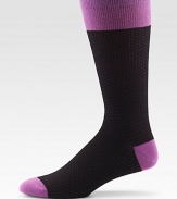 EXCLUSIVELY OURS. The right look for any man, any day of the week with a shape-retaining fit and colorful dots allover. Mid-calf height 80% cotton/20% nylon Machine wash Made in Italy 