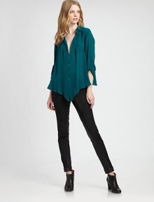 A delicate design made from sophisticated silk. This button-front top features a pleated, plunge front and convenient roll-tab sleeves. Collar neckRoll-tab sleevesDropped shouldersPleated frontButton frontAbout 26 from shoulder to hemSilkDry cleanImported Model shown is 5'10 (177cm) wearing US size Small. 