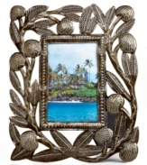 Carved with the bounty of Haiti's all-important breadfruit tree, this hand-cut and hammered picture frame tells a unique story in cleverly re-purposed steel.