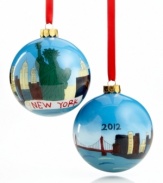 Cherish the memory of Christmas in New York with a glass ornament hand painted with the city skyline and Statue of Liberty. Dated 2012. Shown front and back.