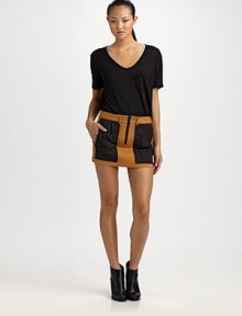 The colorblocked mini, outfitted with crisp pleating and back flap pockets for a hint of utilitarian chic.Mid waistBelt loopsZip-flyFront pleatsBack flap pocketsAbout 12½ long98% cotton/2% elastaneDry cleanImportedOUR FIT MODEL RECOMMENDS ordering true size. 