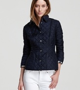 A wardrobe essential, this Burberry Brit quilted jacket sets the framework for smart, strong dressing.