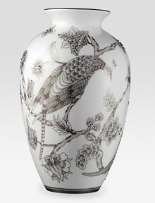Like a beautiful Japanese screen translated to fine bone china, this graceful, urn-shaped vase presents a meticulously rendered peacock surrounded by lush flowers in soft shades of plum and platinum, embellished with hand-set amethyst-tinted Swarovski crystals.Bone chinaCrystals17H X 10W X 7.5DHand washImported Like a beautiful Japanese screen translated to fine bone china, this graceful, urn-shaped vase presents a meticulously rendered peacock surrounded by lush flowers in soft shades of plum and platinum, embellished with hand-set amethyst-tinted Swarovski crystals.Bone chinaCrystals17H X 10W X 7.5DHand washImported