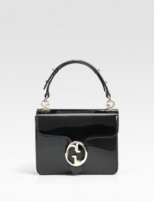Luxe patent leather with gusset construction, finished with a double G closure.Adjustable handle with G-shaped link accents, 4 drop Double G closure Removable engraved logo mirror with leather case Inside zip, snap, and open pockets Leather lining 7W X 6¼H X 2½D Made in Italy Luxe patent leather with gusset construction, finished with a double G closure.Adjustable handle with G-shaped link accents, 4 drop Double G closure Removable engraved logo mirror with leather case Inside zip, snap, and open pockets Leather lining 7W X 6¼H X 2½D Made in Italy