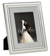 Always look elegant within the Chime picture frame from Vera Wang. Luxe silver plate with clean lines and beveled edges makes a lasting impression all its own. Interior rim features classic ribbed detail.