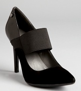 Calvin Klein reinterprets a classic pump, mixing smooth leather with soft suede.