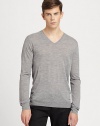 A simple v-neck sweater goes a long way in achieving great style and sophistication and this neatly-shaped rendition is no exception. Knitted from fine merino wool, this pullover is soft and lightweight, making it an ideal choice for seasonal layering.V necklineBanded cuffs and hemMerino woolDry cleanImported