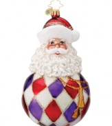 Santa Claus melds with a classic Christmas ball in this lovely hand-painted glass ornament from Christopher Radko to add some joy to your tree this holiday season.