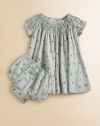 Tailored in airy woven cotton for a gently flowing silhouette, a short-sleeved floral-print dress is beautifully complemented with a smocked neckline and embroidered Swiss dots.Round smocked necklineShort puffed sleevesBack buttonsFull slip with scalloped edgingMatching bloomersCottonHand washImported Please note: Number of buttons may vary depending on size ordered. 