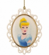 The new belle of your holiday ball. A pretty cameo of Cinderella in ivory porcelain with gold trim, this Lenox ornament will live happily ever after on your tree. Qualifies for Rebate