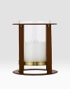 Crafted from gleaming glass, and encased in a supple saddle leather frame to evoke a heritage panache.12 L x 14¼ H6 X 6 candle recommendedLeather, glass and brassImported