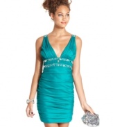 A plunging neckline and rhinestone embellishments make up a smoldering dress from City Triangles!