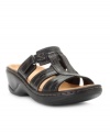 The Clarks Lexi Belle Sandals are a great pick for casual or travel with their adjustable velcro strap, top-stitched accents and soft wedge heel.