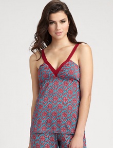 An intricate floral print in rich crimson hues transforms this plunging v-neck design. V-neckSleevelessSolid trim at necklineGathered ruchingViscose/elastaneHand washMade in Italy