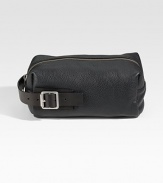 A suitcase staple for any traveler defined by a side handle with buckle detail, in textured leather.Zip closureSide handleFully linedLeather10 x 5¼ x 4½Imported