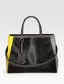 Luxurious halfcalf in a colorblock style with leather trim and signature hardware.Double leather top handles, 5½ dropDetachable leather shoulder strap, 13¼ dropSnap strap closureProtective metal feetOne zip and two open compartmentsTwo inside open pocketsFully lined14W X 10¾H X 6DMade in Italy